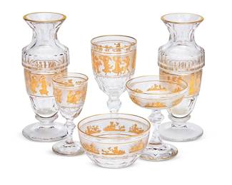 128
A Val Saint Lambert 'Danse de Flore' glassware service
20th century
The vases etched: Val St. Lambert
Each centered by a frosted band decorated in gilt with a procession of classical figures, comprising fifteen 6.75" wine glasses, eight 4.625" champagne coupes of one design, seven 4.625" champagne coupes of another design, fifteen 5" cordials, twelve 4.5" finger bowls, and a pair of 8.75" vases
59 pieces
Estimate: $2,500 - $3,500