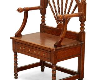 367
An English brass-mounted bobbin-turned oak armchair
19th century
With a fan-shaped spindle back set into an arched top rail, the arms ending with knobs, with a plank seat above a single drawer, all on turned front and squared back legs joined by stretchers
37.25" H x 25.5" W x 18" D
Estimate: $300 - $500