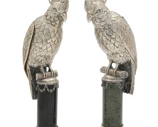 384
A pair of German silver figures of cockatoos
Late 19th/early 20th century
Each with Hanau marks
Each with a detachable head and hinged wings, one on a black marble pedestal and the other on a green marble pedestal
2 pieces
Each: 12.125" H x 5.375" W x 3.75" D
Estimate: $5,000 - $7,000