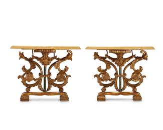 357
A pair of Continental carved giltwood and gesso console tables
Early/mid-19th century with antique elements
Each with carved gilt scrolls, acanthus leaves, and florets, and a green-painted central column, beneath a yellow marble top
2 pieces
Each: 33" H x 40.5" W x 16" D
Estimate: $1,500 - $2,000