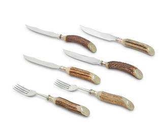 9
An Asprey silver plate-mounted antler-handled flatware service
20th century
The knife blades stenciled: ASPREY LONDON
Comprising 12 forks and two sets of 12 steak knives, personalized
36 pieces
Estimate: $1,000 - $1,500