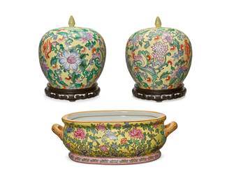 121
A pair of Chinese Famille Jaune porcelain ginger jars and footbath
20th century
Each bearing a red apocryphal reign mark to underside; each jar with sticker: C P C / Made in Macau
Comprising a pair of lidded ginger jars set on carved wood stands, and a footbath, each decorated in floral motifs
3 pieces
Each jar: 9.5" H x 9.5" Dia.; Footbath: 5.75" H x 17.5" W x 11.25" D
Estimate: $300 - $500