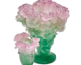 369
Two Daum pâte-de-verre rose vases
Late 20th/early 21st century
Each signed and inscribed: Daum / France
Comprising two green and pink rose-form vases
2 pieces
The larger: 12" H x 12" Dia.
Estimate: $800 - $1,200
