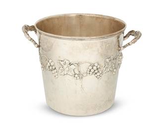 407
A Peruvian sterling silver ice bucket
Mid/late 20th century
Marked to underside: Industria Peruana / Plata Esterlina 925 [flag] Camusso
With grapevine decoration and opposed handles
7.75" H x 11" W x 8.75" D
30.1 oz. troy approximately
Estimate: $700 - $900