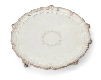 10
A Victorian sterling silver round footed tray
1884
Marked for sterling, for London, and date marked; maker's mark: R & S Garrard [James Garrard]
The tray raised on scrolled feet, featuring a chased foliate medallion and scalloped rim
1.5" H x 15" Dia.
49.5 oz. troy approximately
Estimate: $3,000 - $4,000