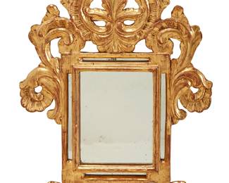 212
A Continental carved giltwood mirror
18th century with later elements
Labeled verso: Cantay / Hoppen
The frame decorated with shells, scrolls, and rocaille
Overall: 30" H x 20.75" W x 1.25" D
Estimate: $500 - $700