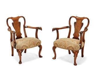 218
A pair of small George I-style open armchairs
20th century
Each with fiddle back, ram's head-form armrest terminals, and cabriole legs, the seat upholstered with gold, blue and brown patterned fabric
2 pieces
Each: 31" H x 25" W x 21" D
Estimate: $200 - $300