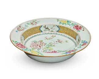 235
A large Chinese Famille Rose porcelain shallow bowl
19th century
Unmarked
The bowl decorated with peonies
3.5" H x 16.25" Dia.
Estimate: $200 - $300