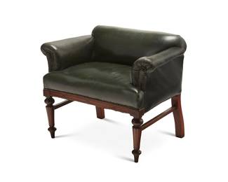 55
A George IV-style leather upholstered mahogany low chair
20th century
The chair upholstered in green leather with flared armrests and brass tacking, raised on turned legs
29" H x 35" W x 24" D
Estimate: $200 - $300