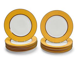 321
A set of twelve Puiforcat porcelain 'Pompei' chargers
1987
Each marked to underside in underglaze green: Limoges / France; and black printed: Puiforcat / Pompei / Création Exclusive / Ed. Memory pour Puiforcat © 87
Each with gold-toned rim
12 pieces
Each: 11.625" Dia.
Estimate: $300 - $500