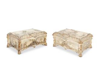 6
Two sterling silver and silver-plated footed jewelry boxes
Early 20th century
Sterling marked: RC / 925; silver-plated marked: Walker & Hall / Sheffield
Comprising a sterling silver footed box and a silver-plated copper footed box with locking hinged lid, each with hinged lid with repoussé decoration depicting putti in a garden landscape, opening to reveal a lined interior
2 pieces
Sterling: 5.5" H x 12" W x 8.5" D; Plated: 6" H x 12" W x 8.5" D
Estimate: $3,000 - $4,000