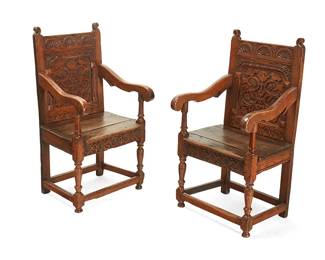 308
A pair of English carved oak wainscot armchairs
17th/18th century
Each back panel carved with fan and floral designs, with slightly scrolled arms resting on turned supports joined by stretchers and ending in turned knob feet
2 pieces
Each: 43" H x 24" W x 22.5" D
Estimate: $800 - $1,200
