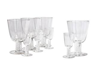 46
A suite of Steuben glass stemware
20th century
Etched: Steuben
Each featuring air twist stems, comprising sixteen 5.75" water goblets and sixteen 3.875" cordials
32 pieces
Estimate: $1,500 - $2,000