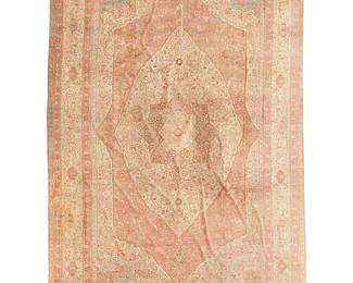 250
A palace-sized Tabriz rug
Circa 1880; Northwest Persia
The wool on cotton foundation rug having a dense floral concentric medallion on a rust field within an ivory scrolling vinery and palmette main border
33' 8" L x 22' 3" W
Estimate: $20,000 - $30,000