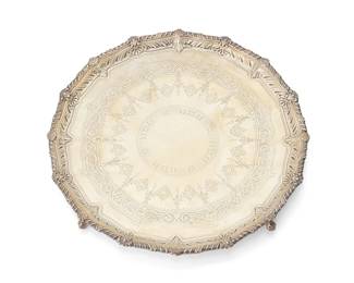 172
A Victorian sterling silver footed tray
1892
Marked for sterling, for Sheffield, and date marked; maker's mark for Albert Henry Thompson
With gadrooned edge and bright cut engraving, on four ball and claw feet
1" H x 12.5" Dia.
31 oz. troy approximately
Estimate: $1,200 - $1,800