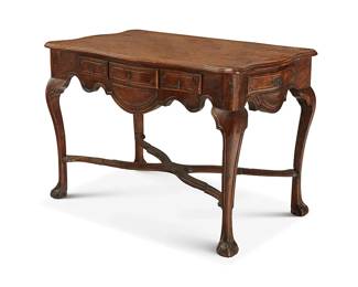 271
A Continental Rococo-style walnut table
18th century
With a scalloped top above three front drawers and two side drawers with iron cotter pin drawer pulls, above an X-form stretcher joining legs with ball and claw feet
32" H x 46" W x 27.5" D
Estimate: $300 - $500