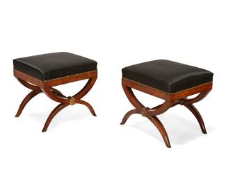 248
A pair of Empire-style parcel-gilt mahogany curule stools
20th century
Each with opposed gilt medallion accents and curved supports joined by a turned bar stretcher, upholstered in a black fabric with brass tacking
2 pieces
Each: 18.5" H x 20" W x 17.5" D
Estimate: $200 - $300