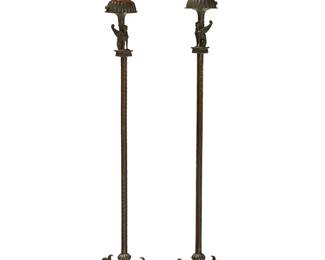303
A pair of Neoclassical-style bronze floor lamps
Late 19th/early 20th century with later elements
The single-light lamps, each with a seated winged sphinx atop an Ionic column ending in a tripod base with paw feet, surmounted by a fabric shade, electrified
2 pieces
Each: 70.5" H x 14" Dia.
Estimate: $800 - $1,200