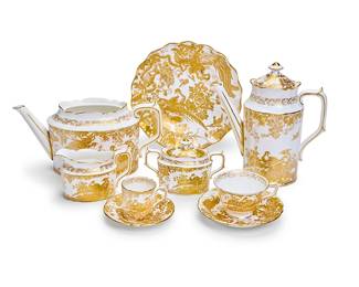 294
A Royal Crown Derby porcelain 'Gold Aves' part tea and coffee service
Date codes for 1962-86
Each with various red printed factory marks above pattern name, number (A.1235), and date code
Comprising seventeen tea cups with twenty-one 5.75" saucers, ten demitasse cups with ten 4.75" saucers, one teapot, one coffee pot, one covered sugar, one cream jug, and thirteen 8.5" dessert plates with scalloped rims
75 pieces
Estimate: $1,500 - $2,000