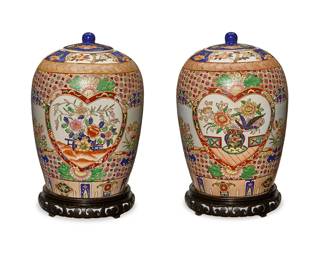 304
A pair of Chinese porcelain covered vases
20th century
Each bearing a red apocryphal reign mark to underside; one with a partial Macau sticker
Each lidded vase with floral bunches within cordiform friezes and a floral medallion ground, raised on a carved wood stand
2 pieces
Each overall: 15.25" H x 9.5" Dia.
Estimate: $200 - $300