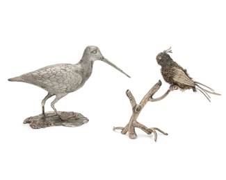 168
Two Italian bird-form table ornaments
Mid/late 20th century
Shore bird marked for maker and sterling
Comprising an .800 silver Buccellati-style silver 'furry' figure of a cockatoo, depicted perched on a silver branch, and a Romeo Miracoli & Figlio sterling silver figure of a shore bird
2 pieces
Furry: 6.25" H x 3" W x 5" D; Shore: 5.375" H x 8.875" W x 3.5" D
Total weight: 35 oz. troy approximately
Estimate: $700 - $900