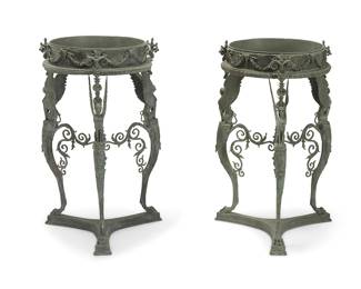 268
A pair of Italian Grand Tour-style patinated bronze jardinière stands
Late 19th/early 20th century
The athénienne-form stands after a table found at Pompeii, the frieze decorated with garlands and bovine masks raised on three supports, each headed by a winged sphinx and ending in paw feet, joined by a scrolled foliate stretcher and raised on a tripartite base
2 pieces
Each: 37" H x 22" Dia.
Estimate: $1,200 - $1,800