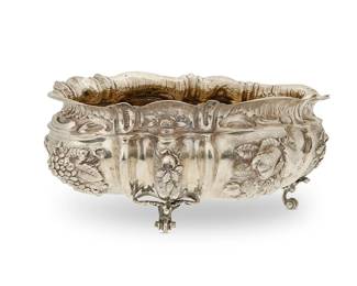 389
A large Continental-style .800 silver oval footed center bowl
Late 19th/early 20th century
Marked to underside: 800
With repoussé decoration of fruit, raised on scrolled feet
8" H x 20" W x 15" D
76.4 oz. troy approximately
Estimate: $1,500 - $2,000