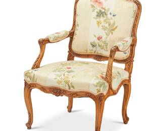 355
A Louis XV-style carved fruitwood fauteuil
Late 19th/early 20th century
The frame carved with floral and foliate motifs, upholstered in cream and gold striped fabric with fruit and foliate motifs
42.5" H x 28" W x 28" D
Estimate: $300 - $500