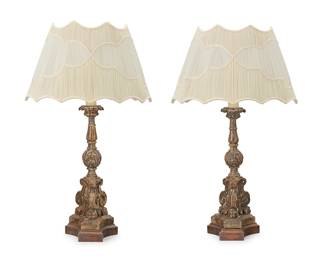 296
A pair of Italian Baroque wood candlestick lamps
18th century with later elements
Each carved gesso and painted wood candlestick with a tripartite base, later mounted as a single-light table lamp, with a pleated fabric shade, electrified
2 pieces
Overall 33.5" H; Candlestick without mounts 19.5"; Each shade: 12.5" H x 21" W x 15" D
Estimate: $500 - $700