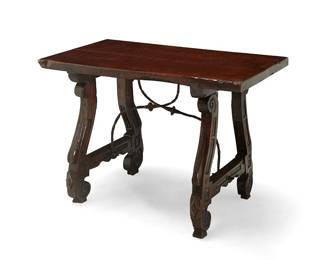 104
A Spanish wrought-iron and carved walnut fratino table
18th century
With a single-panel top supported by lyre-form legs and feet joined by wrought-iron curvilinear X-form stretchers
30.5" H x 45" W x 26" D
Estimate: $700 - $900