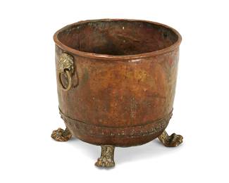 292
A Victorian brass and copper fuel bin
19th century
Flanked by lion mask ring handles and raised on paw feet
15" H x 16" W x 17.5" D
Estimate: $400 - $600