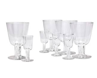 269
A suite of Steuben clear glass stemware
Late 20th/early 21st century
Each etched to underside: Steuben
Comprising fourteen 5.75" water goblets and fourteen 3.875" cordials, each with air twist stems
28 pieces
Estimate: $1,200 - $1,500