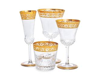 359
A Saint-Louis 'Thistle' glassware service
20th century
Each with etched factory marks
Comprising twelve 7.75" champagne flutes, twelve 7.5" water goblets, eleven 7" red wine glasses, twelve 6.25" white wine glasses, and ten 3.5" old-fashioned glasses
57 pieces
Estimate: $4,000 - $6,000