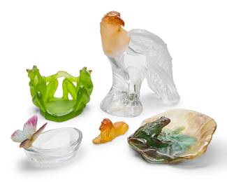 267
A group of Daum pâte-de-verre table items
Mid/late 20th century
Each signed and inscribed: Daum / France
Comprising a green dish featuring two figures of frogs with gilt-metal eyes (3.5" H x 6" W x 4.25" D), an amber frosted and clear glass figure of a perched eagle (8" H x 7" W x 7" D), a clear glass dish with a butterfly on the edge (3" H x 4.75" W x 3.25" D), a vide-poche in the form of a lily pad with frog (2" H x 6.25" W x 6" D), and an amber glass lion figure (1.5" H x 3.4" W x 1" D)
5 pieces
Estimate: $400 - $600