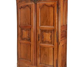 299
A Louis XV Provincial carved fruitwood armoire
18th/19th century with updated interior
With carved acanthus and shells, enclosed by a pair of paneled doors opening to reveal an updated interior of two shelves and six drawers, raised on bun feet
94" H x 62" W x 28" D
Estimate: $700 - $900