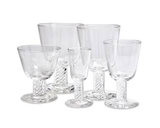 126
A suite of Steuben glass stemware
20th century
Etched: Steuben
Each featuring air twist stems, comprising two 5.25" wine glasses, three 3.75" cocktail glasses, eighteen 3.875" cordial glasses, and 2 others (5.125" H and 4.375" H)
25 pieces
Estimate: $600 - $800