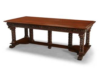 52
A Victorian carved oak library table
Late 19th/early 20th century
The molded rectangular top with ogee border above a heavily carved apron fitted with two drawers, each drawer interior with later moiré lining, supported by seven barley-twist cluster columns above a platform stretcher, all on four scrolled feet
30" H x 84" W x 40" D
Estimate: $1,500 - $2,500