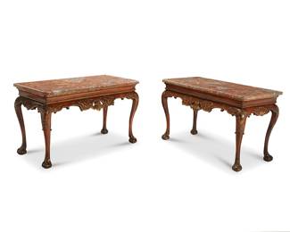 276
A pair of George III parcel-gilt walnut console tables
Late 18th century with later elements
Each surmounted by a mottled marble top, with gilt accents to the carving, raised on cabriole legs terminating in claw-and-ball feet
2 pieces
Each overall: 32.5" H x 55" W x 26" D
Estimate: $2,000 - $3,000
