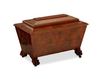 295
A Regency mahogany cellarette
Early 19th century
Of sarcophagus form, flanked by lion's head ring handles, raised on paw feet with casters
21" H x 30" W x 18" D
Estimate: $300 - $500