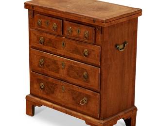 90
A George II-style burl walnut bachelor's chest
19th century
The folding top above two short and three long drawers, on bracket feet
28" H x 24" W x 13" D
Estimate: $500 - $700