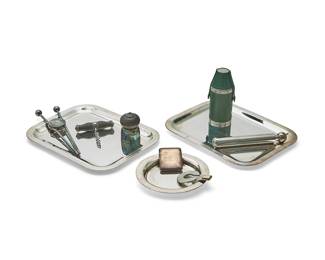 185
A group of Christofle silver-plated utensils and bar items
20th century
Most marked for Christofle; cigar cutter with mark of Must de Cartier (round style)
Comprising 12 miscellaneous Christofle utensils, 11 Christofle iced tea spoons, and a group of 6 Christofle silver-plated items including a wine coaster, three rectangular trays, a corkscrew, and a bottle stopper; together with a parcel-gilt metal cigar cutter, a match safe, a flask frame, a cylindrical flask, and a toothpaste tube key, some pieces personalized
34 pieces
Cylindrical flask: 6" L; Match safe" 2.375" H x 1.875" W; Flask frame: 4" H x 3.125" Dia.
Estimate: $600 - $800