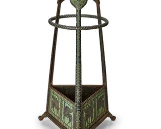 364
An Egyptian Revival fireplace tool stand
Circa 1870
The patinated-iron and bronze stand with lower panels depicting Egyptian motifs, raised on three winged paw feet
24" H x 11" Dia.
Estimate: $400 - $600