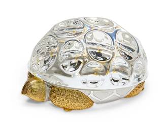 291
A Steuben gilt sterling silver and glass turtle sculpture
Late 20th century
Etched to underside: Steuben; impressed to body: Steuben / STERLING
Model 1016, Designed by Paul Schulze, model introduced 1969
Housed in original fitted box
Figure: 3" H x 5.5" W x 4" D; Box: 5.75" H x 7.75" W x 7.75" D
Estimate: $1,000 - $1,500
