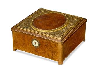 320
A French gilt-metal-mounted burlwood table box
20th century
With four small square feet and locking lid, revealing a purple velvet-lined interior
3.25" H x 6.5" W x 6.5" D
Estimate: $200 - $300
