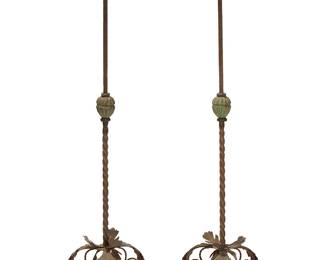 59
A pair of Spanish Baroque-style wrought iron torchères
19th/20th century
Each on a tripod leaf-form base issuing a partial twisted standard, surmounted by a leaf-form bobèche
2 pieces
Each: 87" H x 20" Dia.
Estimate: $300 - $500