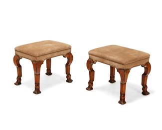 333
A pair of George I walnut and suede foot stools
Circa 1720 with later elements
Each upholstered in beige suede with brass tacking, raised on carved walnut 'broken' cabriole legs
2 pieces
Each: 16" H x 19" W x 15" D
Estimate: $1,000 - $1,500