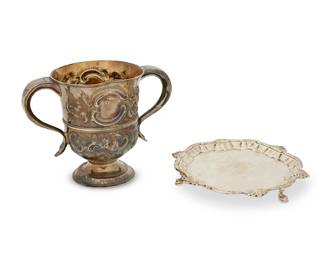 177
A George III sterling silver salver and footed cup
Mid/late 18th century
Each marked for sterling and for London; cup date marked for 1764 and maker William Priest & James Priest; salver date marked for 1786 and maker William Peaston
Comprising a two-handled footed cup with repoussé floral and foliate motifs (5.5" H x 7.75" W x 4.5" D), and a footed salver with engraved armorial (1" H x 7" Dia.)
2 pieces
Total weight: 22 oz. troy approximately
Estimate: $600 - $800