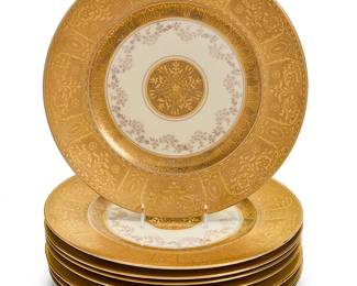 105
A set of eight Hutschenreuther porcelain dinner plates
Early/mid-20th century
Green printed Crown Lion Ivory factory marks
Each with wide gilt embossed rims, floral swags, and a central gilt medallion on cream ground
8 pieces
Each: 10.875" Dia.
Estimate: $400 - $600