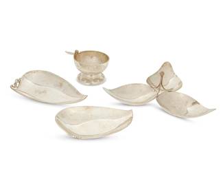 175
Four Mexican sterling silver table items
Mid-20th century
Each marked for sterling; tripartite marked for CLS; graduated marked for maker R. Rodriguez; bowl marked for maker Febres
Comprising a leaf-form three-section serving dish (4" H x 10.75" W x 11.5" D), a graduated pair of abstract leaf-form dishes in the Danish style (Larger: 1.5" H x 9" W x 6" D), and a footed bowl with chased kiva step and swirling motifs, featuring a bird figure mounted to rim (3.75" H x 6" W x 4.625" D)
Total weight: 38 oz. troy approximately
Estimate: $800 - $1,000