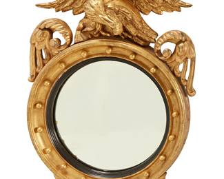 44
A Regency carved giltwood convex mirror
Early 19th century
The circular plate within an ebonized slip, surmounted by an eagle, with foliate ornament below
38" H x 25" W x 8" D
Estimate: $400 - $600